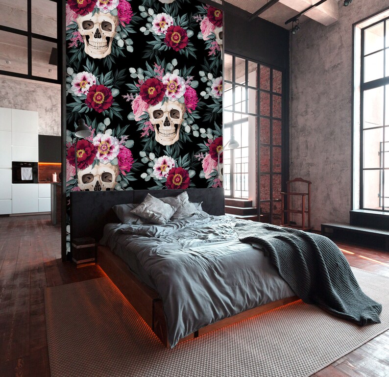 May include: A black and white floral wallpaper with a repeating pattern of skulls and flowers. The flowers are pink, red, and white. The skulls are white with black eyes and a black nose.