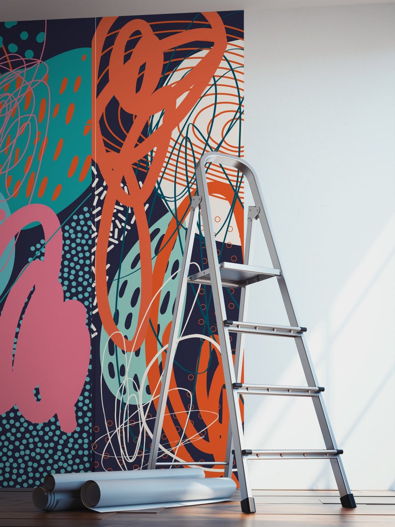 May include: A silver step ladder is positioned in front of a wall with a colorful abstract wallpaper featuring geometric shapes, lines, and dots in shades of blue, green, orange, and pink.