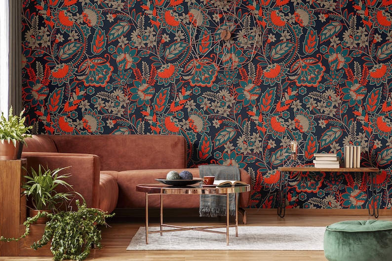 May include: A living room interior with a brown couch and a coffee table. The wall is covered in a teal and orange floral wallpaper.