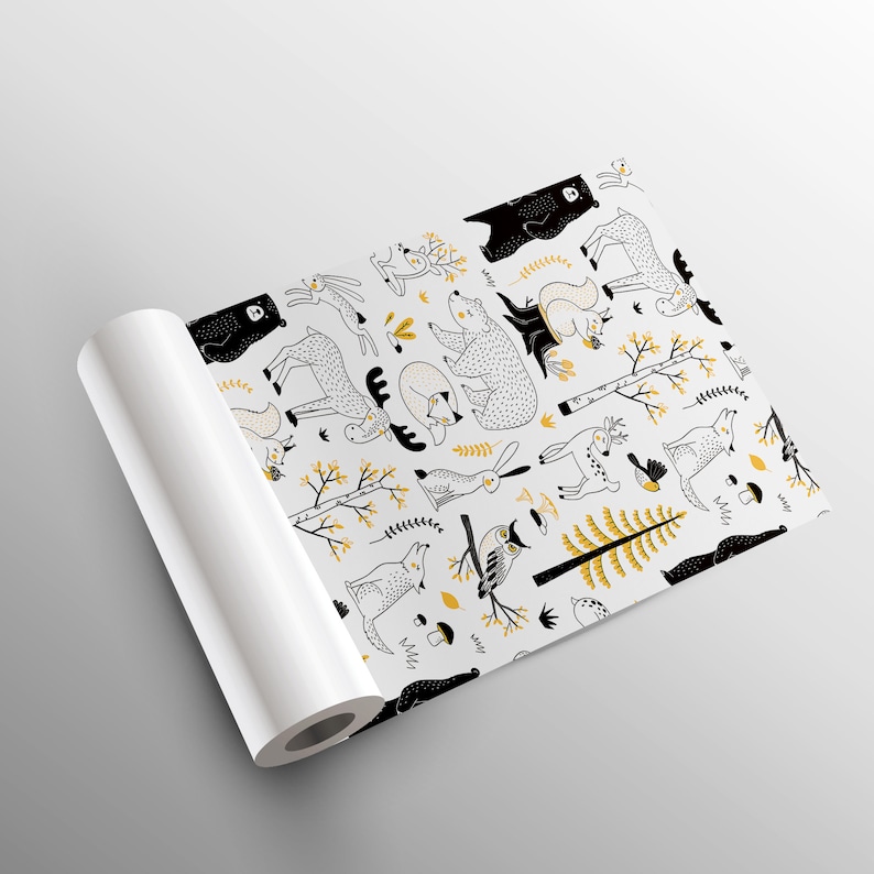 May include: A white background with a repeating pattern of black and yellow woodland animals. The animals include bears, deer, foxes, owls, squirrels, rabbits, and birds. The pattern is perfect for wrapping paper or fabric.