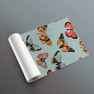 May include: A roll of wrapping paper with a repeating pattern of colorful butterflies on a light blue background.