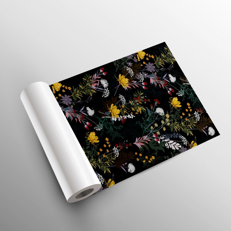 May include: A roll of black fabric with a floral pattern featuring yellow, red, white, and purple flowers. The fabric is rolled up and ready to be used for crafting or decorating.