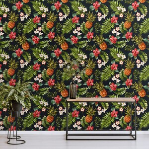 May include: A dark blue wallpaper with a tropical pattern featuring pineapples, green leaves, red flowers, and white flowers.