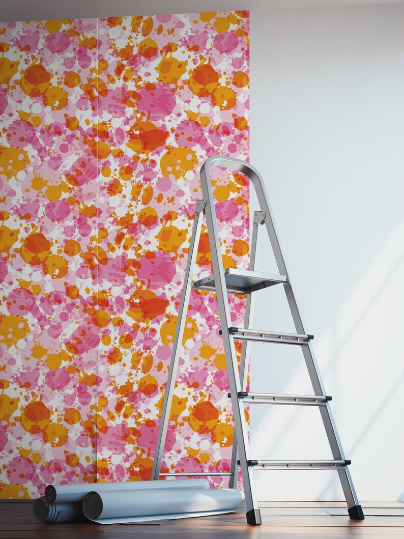 May include: A roll of wallpaper with a pink and orange splatter paint design. A silver step ladder is in the foreground.