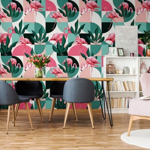 May include: A dining room with a pink and green geometric wallpaper featuring pink flamingos. The wallpaper has a modern design with circles and squares. There is a wooden table with four black chairs and a pink armchair in the room.