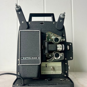 Vintage Bell & Howell 8mm Movie Projector Auto Load No. 256, circa 1950s, working condition, collectible