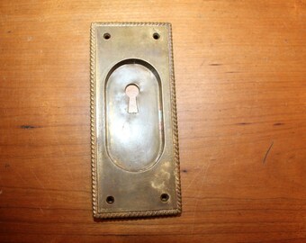 Pocket Door Cast Bronze Escutcheon with Rope Perimeter S-48