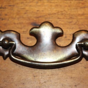 One Vintage Heavy Stamped Brass Plated Batwing Drawer Drop Bail Pull Handle H-23