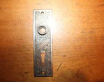 Antique Single Keyhole Entry Corbin Ceylon B-11400 Brass on Iron Escutcheon S-4