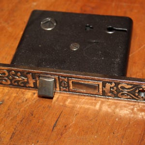 May include: A rustic wooden sign with the text "Welcome to our home" in white lettering. The sign features a distressed finish and a simple, inviting design, perfect for entryway decor.