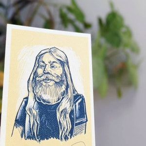 May include: A hand-drawn illustration of a person with long, flowing hair and a beard. The person is wearing a dark blue jacket and has a light yellow background.