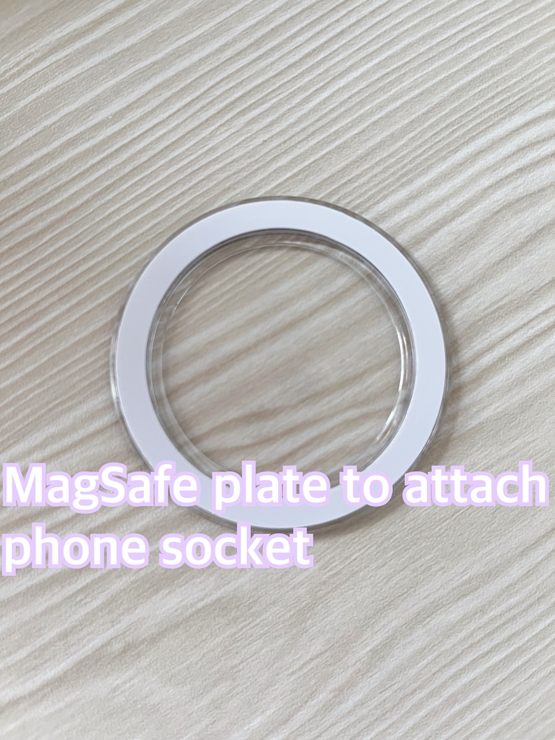 以下が含まれることがあります： 電話ソケットを取り付けるための白い接着剤付きMagSafeプレート