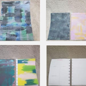 May include: A collection of abstract art journal pages. The pages feature colorful brushstrokes in shades of blue, green, gray, and yellow. Some pages are blank with lined paper, while others have painted designs.