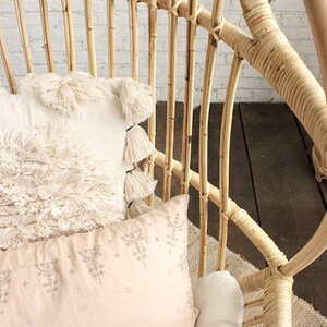 A Sedona Moonrise hanging rattan chair close up with the intricate binding highlighted.