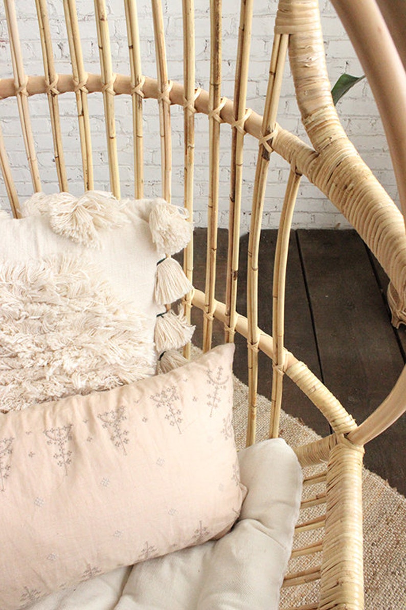 A Sedona Moonrise hanging rattan chair close up with the intricate binding highlighted.