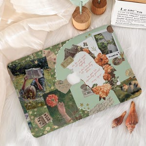 May include: A decorative laptop case featuring a collage design with floral and nature-themed imagery. The case has a green background with various images, including a person reading, flowers, and text. The case also has a white apple logo.
