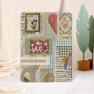 May include: A decorative tablet case featuring a collage of vintage-style images. The design includes framed floral prints, a heart shape, and musical notes, with a mix of green, blue, and beige tones. The case is rectangular and appears to be made of a durable material.
