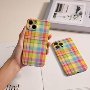 May include: A set of three ceramic mugs with a speckled, matte finish. The mugs are in shades of cream, light gray, and dark gray. Each mug has a simple, minimalist design, perfect for coffee or tea.