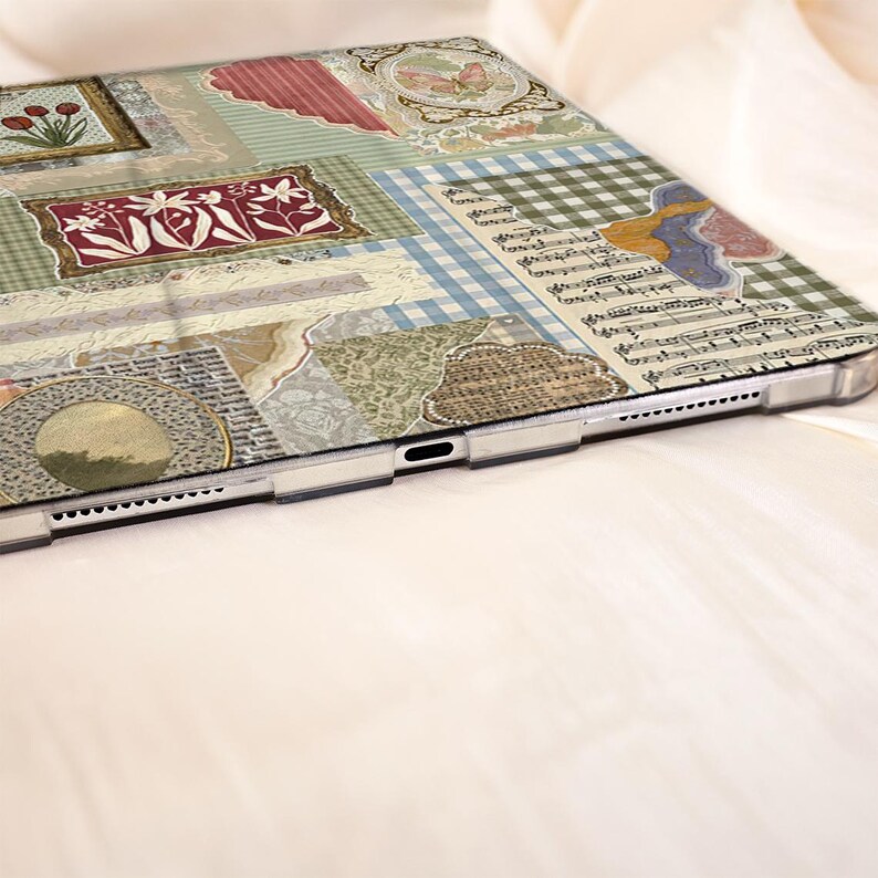 May include: A tablet case with a patchwork design. The case features floral motifs, musical notes, and gingham checks in green, pink, blue, and beige. The case has a clear border. The design is reminiscent of a collage.