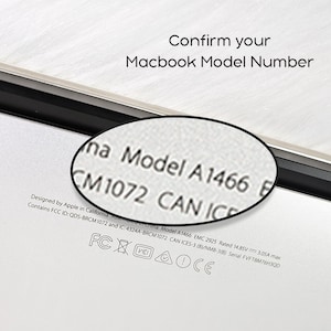 May include: A close-up of a Macbook with the text "Confirm your Macbook Model Number." The model number A1466 is visible, magnified by a circular lens. The Macbook is on a white surface.