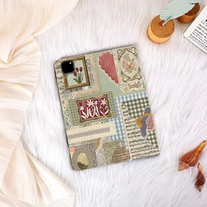 May include: A tablet case with a patchwork design, incorporating vintage-style patterns and framed botanical illustrations. The case features a mix of textures and colours, including green, red, and beige, creating a unique artistic design. The case is designed to fit a tablet.