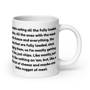May include: White ceramic coffee mug with a curved handle. The mug features black text that reads: "date's eating all the fully loaded nachos..." The mug is designed for hot beverages and is suitable for home or office use.