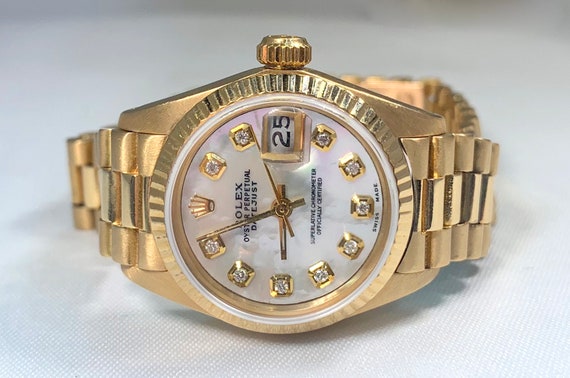 ladies rolex watch with mother of pearl face