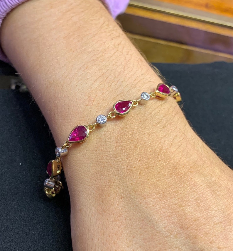 Diamond and Ruby Bracelet. 18ct Yellow and White Gold Line Brace Diamond and Ruby Bracelet. 18ct Yellow and White Gold Line Brace