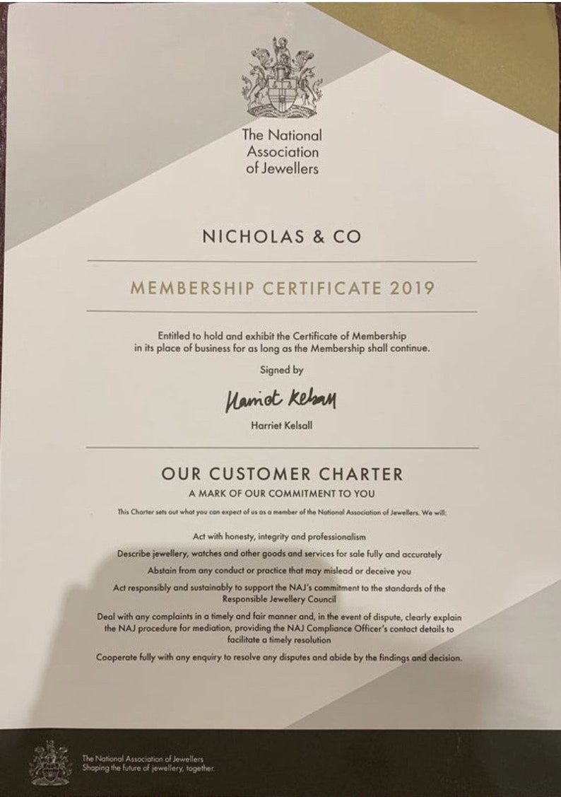 May include: A white membership certificate for Nicholas & Co. from the National Association of Jewellers. The certificate is dated 2019 and states that the business is entitled to hold and exhibit the certificate for as long as the membership continues. The certificate is signed by Harriet Kelsall.