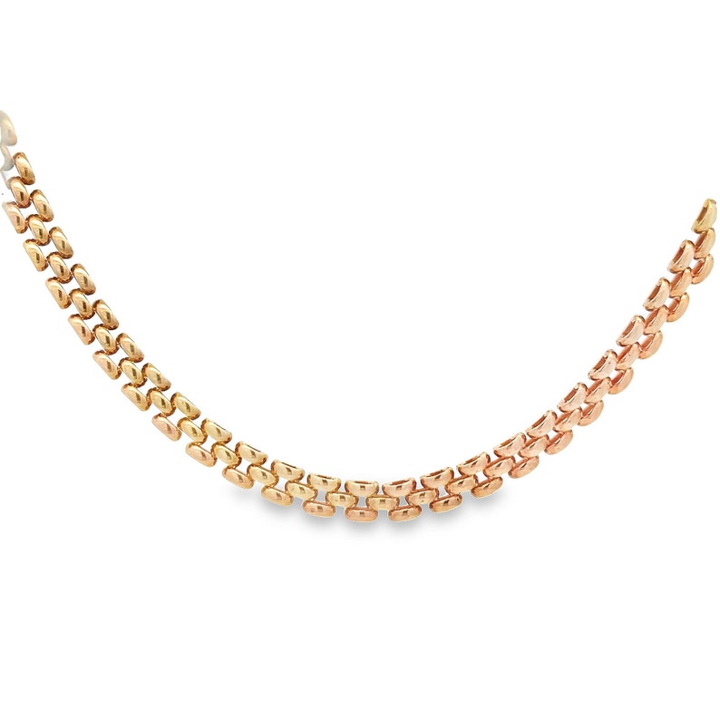May include: A gold chain necklace with a tri-color design. The chain is made of alternating links of yellow, rose, and white gold.