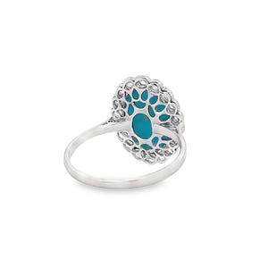 May include: A silver ring featuring a turquoise oval stone set in a filigree design.