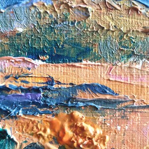 May include: Abstract painting with thick layers of blue, green, orange, and yellow paint. The paint is applied in a textured, impasto style, creating a sense of depth and movement.