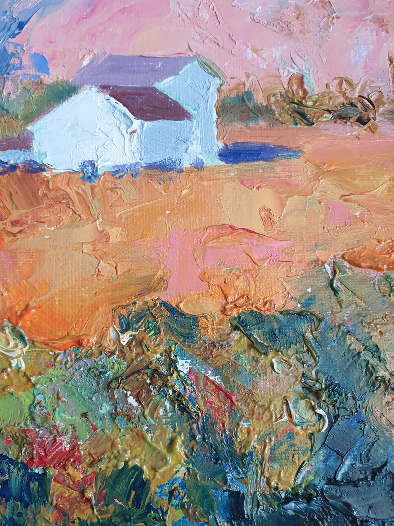 May include: A painting depicting a white house with a brown roof situated in a field. The sky is a soft pink and orange. The field is painted in a textured style with shades of orange, green, and blue.