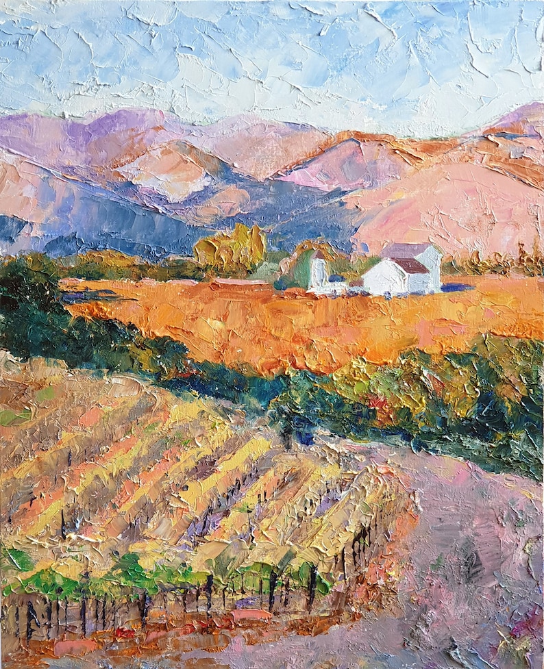 May include: A painting depicting a vineyard landscape with a white farmhouse in the distance. The vineyard is in the foreground, with rows of grapevines and a dirt path leading up to the farmhouse. The hills in the background are painted in shades of purple, pink, and blue.