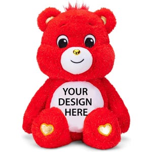 Könnte beinhalten: Ein roter Plüschbär mit weißem Bauch, goldenen Akzenten und dem Text "YOUR DESIGN HERE". Der Bär hat ein lächelndes Gesicht, schwarze Augen und eine kleine goldene Nase. Die Pfoten des Bären haben goldene herzförmige Details.