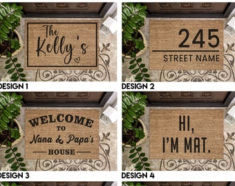 May include: Six different designs for a welcome mat. The first design says "The Kelly's" with a heart. The second design says "245 Street Name". The third design says "Welcome to Nana & Papa's House". The fourth design says "Hi, I'm Mat.". The fifth design says "The Williams Family". The sixth design says "C&T Est. 2003".