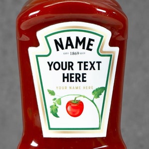 May include: Red plastic ketchup bottle with a white label that says "NAME" and "YOUR TEXT HERE".