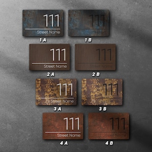 May include: Eight rusty metal house number signs with the number 111 and the text "Street Name" on each sign. The signs are arranged in two rows of four, with the top row labelled 1A, 1B, 2A, and 2B, and the bottom row labelled 3A, 3B, 4A, and 4B.