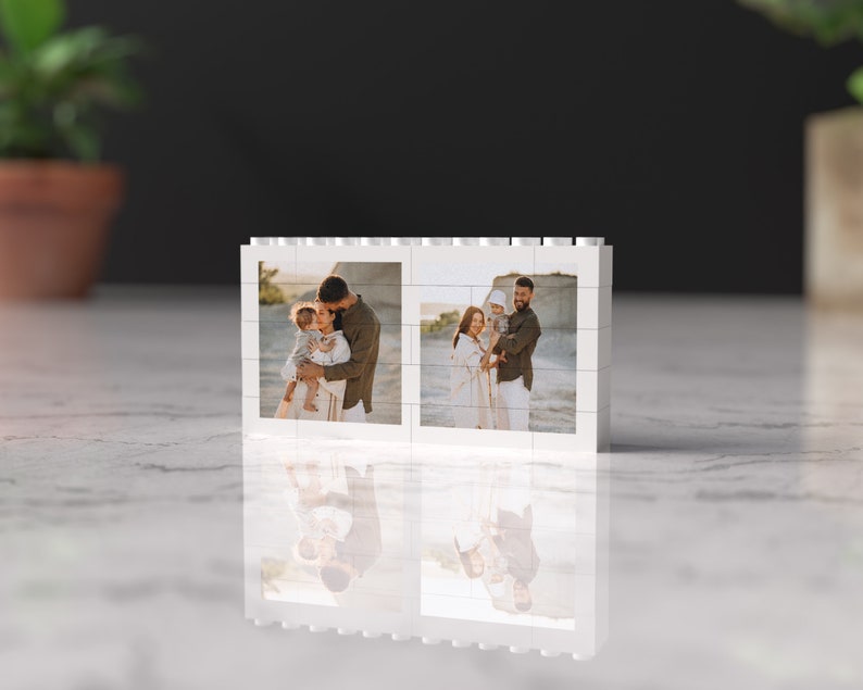 May include: A white photo frame with two images of a family of three on a beach. The family is smiling and holding each other. The frame is made of white plastic and has a simple design.