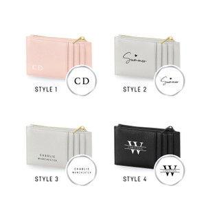 May include: Four different styles of zippered card holders. The first is pink with the initials "CD" in white. The second is grey with the word "Summer" in black. The third is grey with the text "Charlie Manchester" in black. The fourth is black with the letter "W" and the word "Christina" in white.