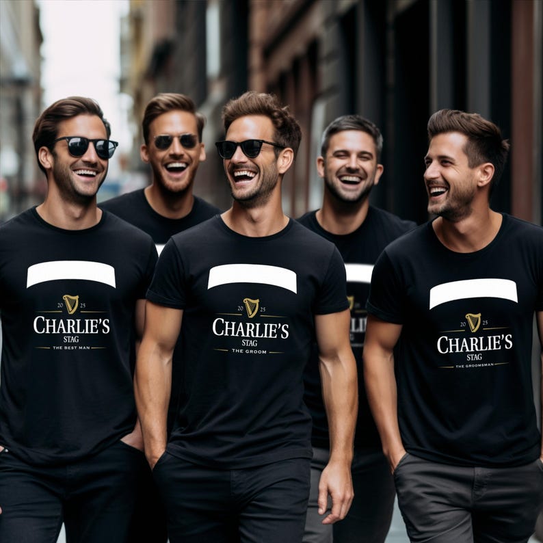 May include: Five men wearing black t-shirts with the text "Charlie's Stag" and a white banner. The shirts also feature the text "The Best Man", "The Groom", and "The Groomsman". The men are smiling and wearing sunglasses.