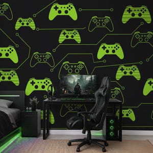 May include: A black wall mural featuring a repeating pattern of bright green video game controllers connected by thin green lines. The design includes various controller styles, some solid and some with horizontal stripes, set against a dark background.
