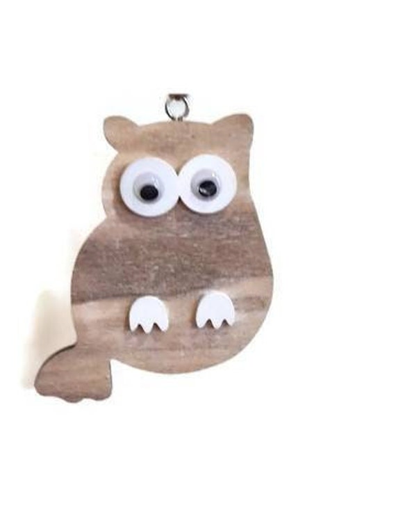 87 favorites don't lie — this rustic hand-carved wooden owl has the quiet charm of something you'd find in a mountain cabin shop.