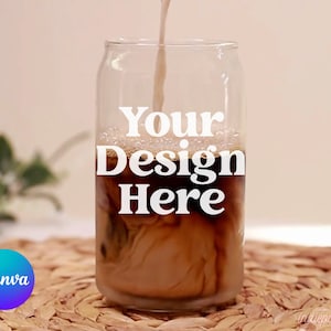 May include: A clear glass can with a brown liquid inside. The can has the text "Your Design Here" printed on the side.