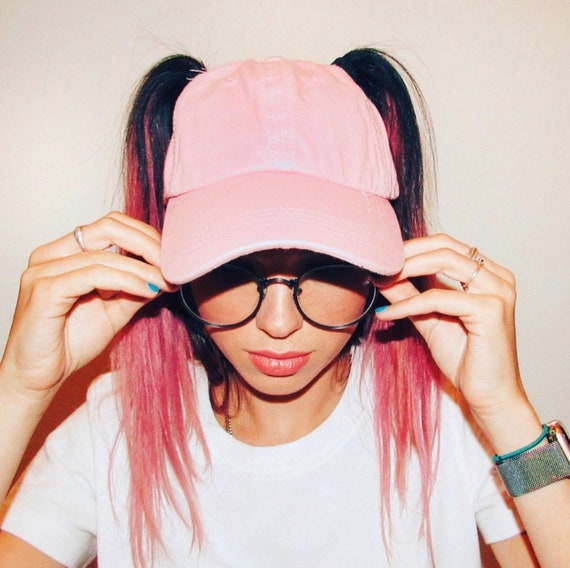 hat with pigtail holes