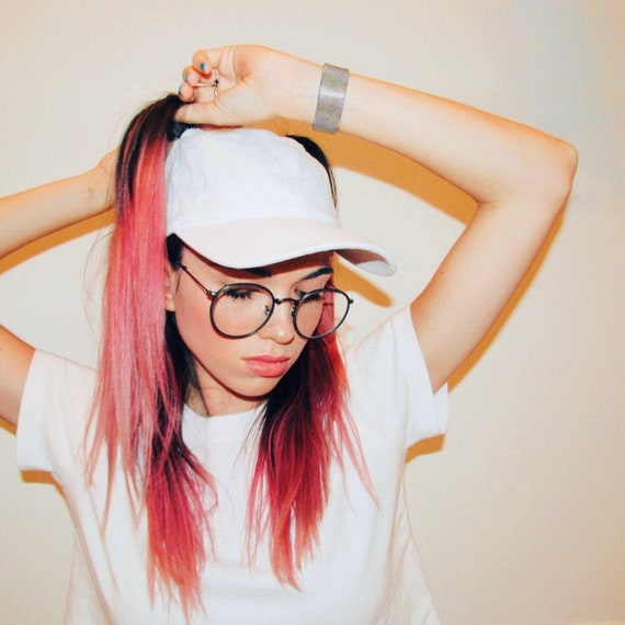 hat with pigtail holes