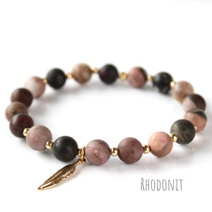 Bracelet plaqué or en rhodonite avec pendentif aile. Bijoux talismans. Pierre précieuse de 8 mm. Bracelet de guérison
