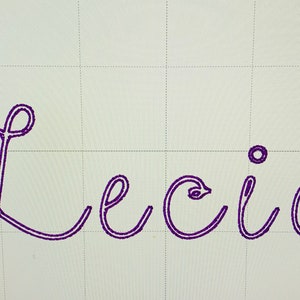 May include: A cursive handwritten name "Lecia" in purple ink on a white background with a grid pattern.