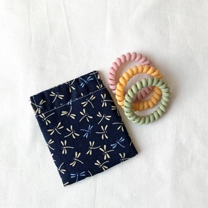 Portamonete con chiusura automatica a forma di libellula, portamonete a forma di scheggia, custodia per auricolari, custodia per cavi, porta rossetto, astuccio portachiavi, mini portafoglio.