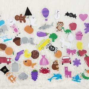 May include: A set of colorful felt stickers featuring various objects, animals, and shapes. The stickers are perfect for crafts, scrapbooking, and other creative projects.